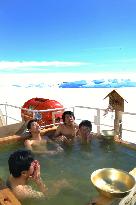 Icebreaker crew take open-air New Year bath in Antarctica